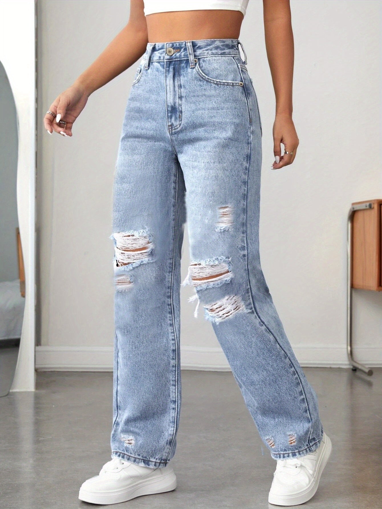 women’s high-waisted straight-leg ripped jeans.